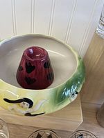 Close view of interior and artwork of tiki bowl