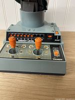 Front control panel showing joysticks, energy level indicator and base details