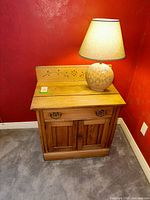 Full view of cabinet with lamp on top