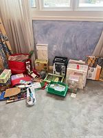 Group shot of all boxed items, gift sets, gift boxes and bags on floor