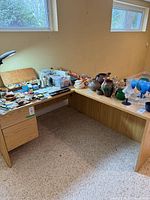 Overall view of L-shaped desk with drawers visible