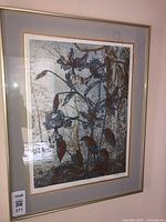 Framed limited edition print on wall