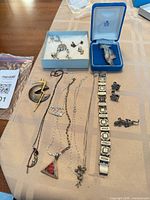 Overview of all jewellery pieces laid out on cloth