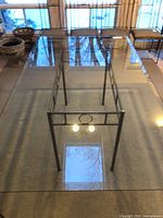 Full view of glass dining table showing top and base