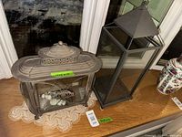 Both lanterns side by side on windowsill