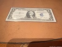 Front of 1935-D $1 silver certificate showing serial I98904581G and blue seal