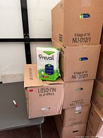 Stacked sealed cartons with one retail bag shown