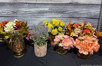Group shot showing all six faux flower arrangements and their containers