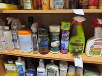 Shelf with multiple cleaning products visible