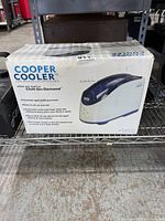 Front of retail box showing Cooper Cooler branding and product image