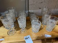All 12 cut glass pieces on shelf