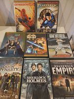 Front covers of eight DVD cases showing titles