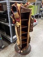 Full view of golfer themed CD stand showing exterior golf bag design and interior shelves