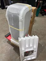 Kenmore portable air conditioner wrapped in foam with styrofoam insert visible