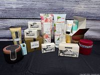 Group shot of all unopened body washes, creams, soaps and related items