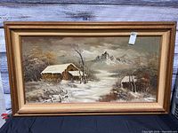 Full view of framed winter landscape oil painting