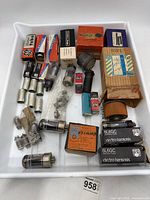 Overview of tray with boxed and loose vacuum tubes