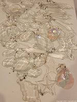 Group view of assorted clear and iridescent chandelier crystals