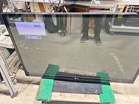 Front view of LG plasma TV powered on showing HDMI1 no signal message