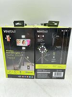 Rear and side views of boxed Vivitar wireless dual LED selfie stick tripods
