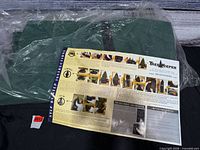 Instruction sheet atop folded green storage bag