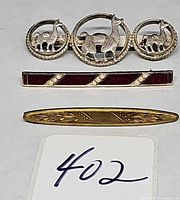 Front view of all three brooches