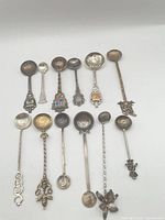 Group shot of all 12 coin-bowl spoons