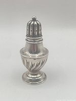 Front view of complete pepper pot with lid attached