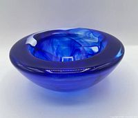 Angled view of cobalt blue bowl showing rim and swirl pattern