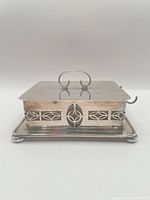 Complete sardine dish assembled showing lid, holder and tray