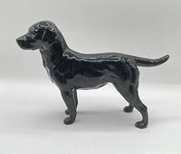 side profile of glazed black Labrador figurine
