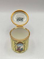 Trinket box open showing interior lid print and hinge