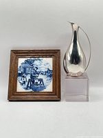 Pitcher and framed tile together