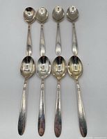 All eight teaspoons fronts shown