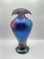 Front view of iridescent glass vase showing overall shape and color gradients