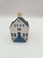 Front view showing façade, windows, door, stairs