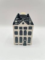 Front view of porcelain canal house bottle showing façade and detailing