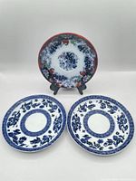 Front view of all three saucers: two blue & white Coalport, one Imari-style Corey Hill
