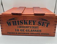 Closed wooden presentation box showing branded side