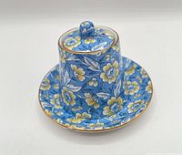 Complete jam pot with lid and saucer showing chintz pattern and gilt trim