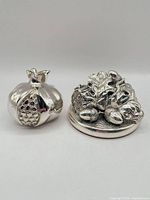 Both silver ornaments side by side
