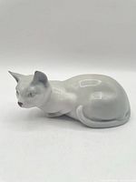 Left side profile of porcelain cat showing overall shape