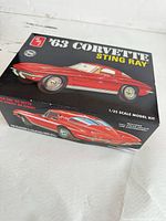 Box top showing AMT logo and car illustration