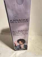 Front of sealed MVMT Bling Karaoke Mic & Speaker box showing branding and marketing text