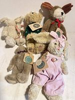 Group shot of six Boyds Bears plush animals with tags visible