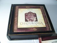 Closed wooden Chaturanga game case with cover art