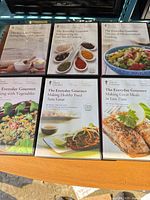 Top view of six The Great Courses Everyday Gourmet DVD sets displayed on shelf