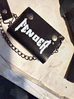 Front view showing Fender logo, leather texture, chain and belt clip