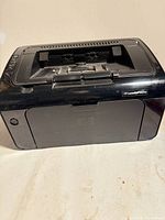 Front and top view of HP LaserJet P1102w printer