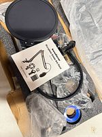 Kit in box with pop filter, manual, boom arm, clamp and accessories